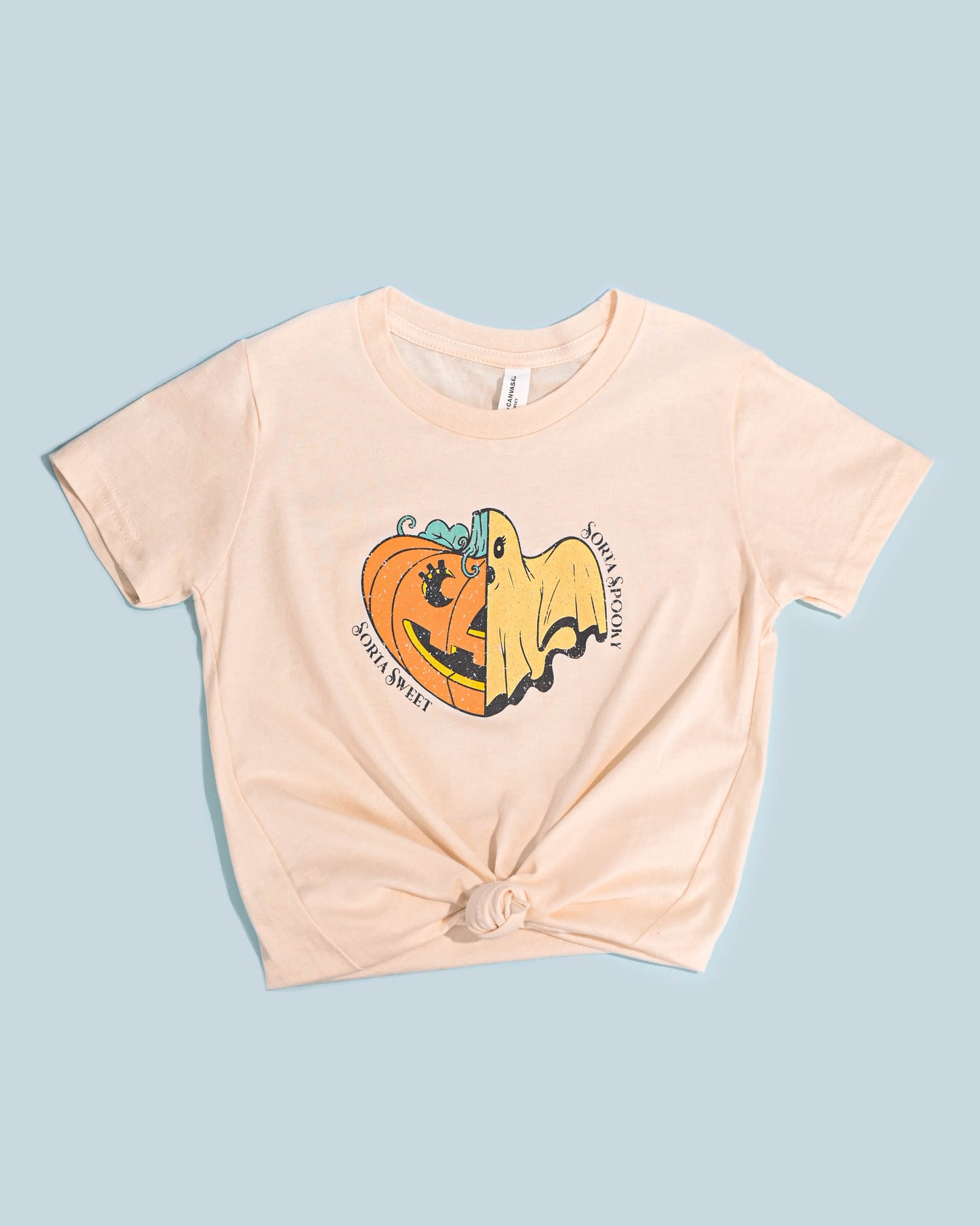 Off-white kids' t-shirt with a 'Sorta Sweet Sorta Spooky' ghost and pumpkin graphic.